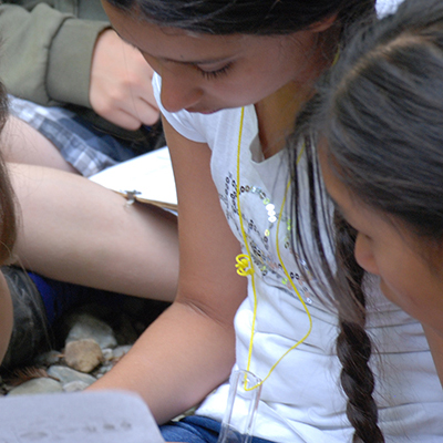 Two students are reading a document